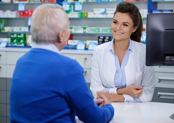 Female healthcare worker speaking/counseling a senior citizen.